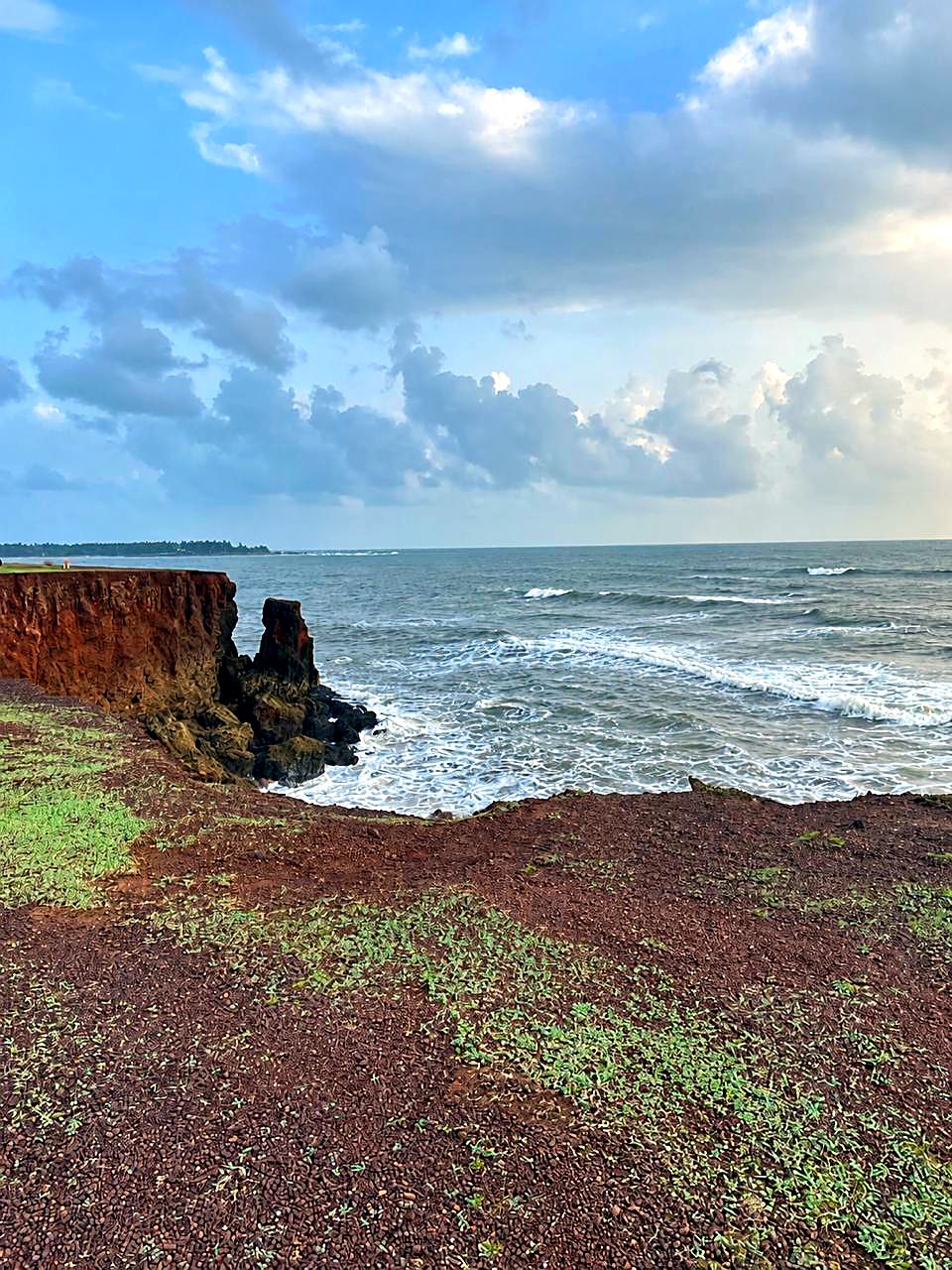 Red laterite cliff above the sea